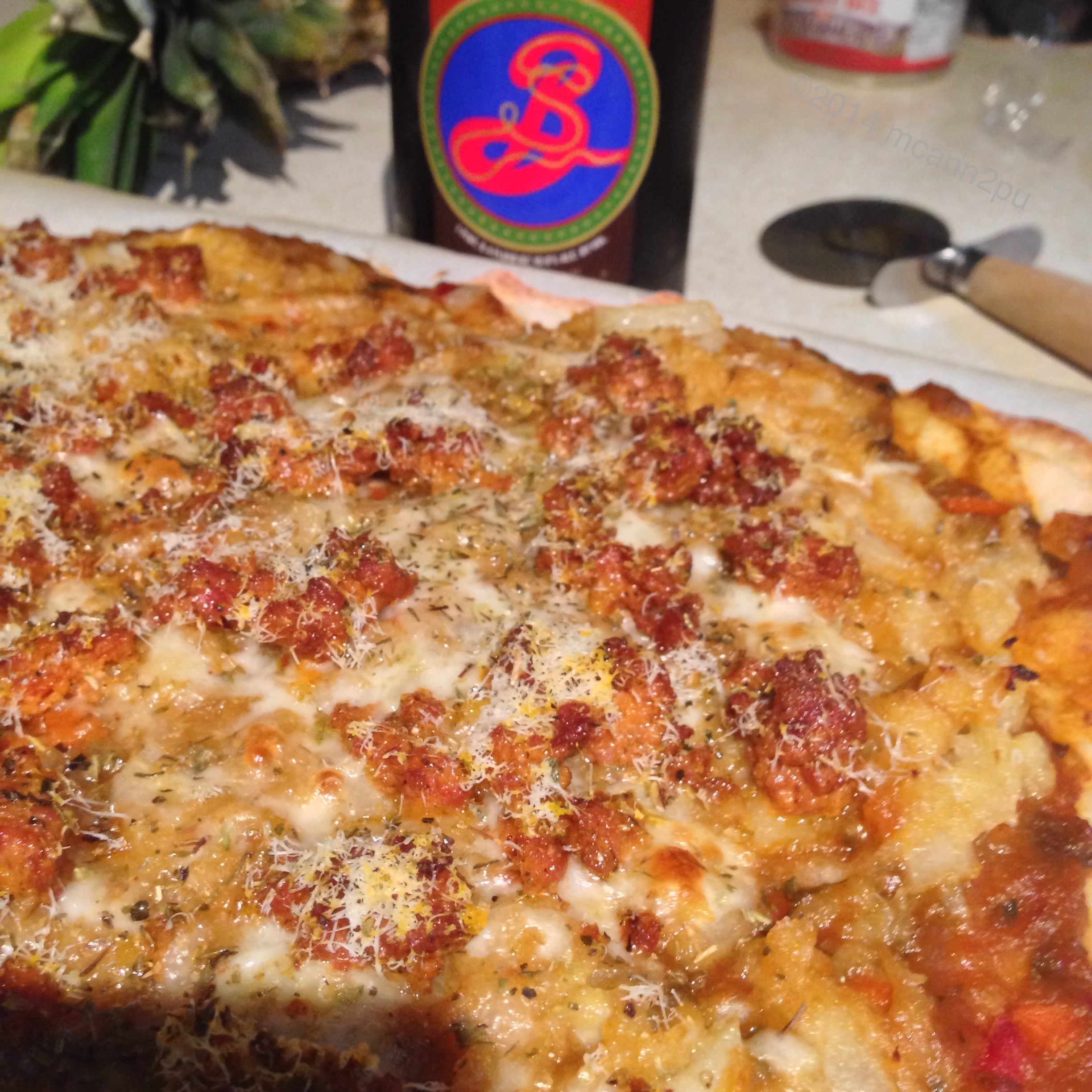 HomemadePizza: What better #BeerPairing to have while reading @SteveKHindy's newly released book #TheCraftBeerRevolution than @BrooklynBrewery's #WildStreak  and some homebaked #pizza? This #GoldenAle was aged in second-use bourbon barrels and re-fermented with #Brettanomyces, making it a great pairing choice for: a crab pizza (first picture) made on a #homemade pizza dough bottom topped with home canned tomato sauce made from tangy homegrown heirloom #GreenZebra tomatoes topped with lump crab meat and sprinkled with cheese and herbs, and a sweet onion/kielbasa pizza (second photo) with sautéed onions and homemade kielbasa sausage made from home ground picnic cut pork mixed with spices. The #beer's bourbon side complemented the kielbasa while the Brett's funkiness went great with the tangy seafood pizza. 