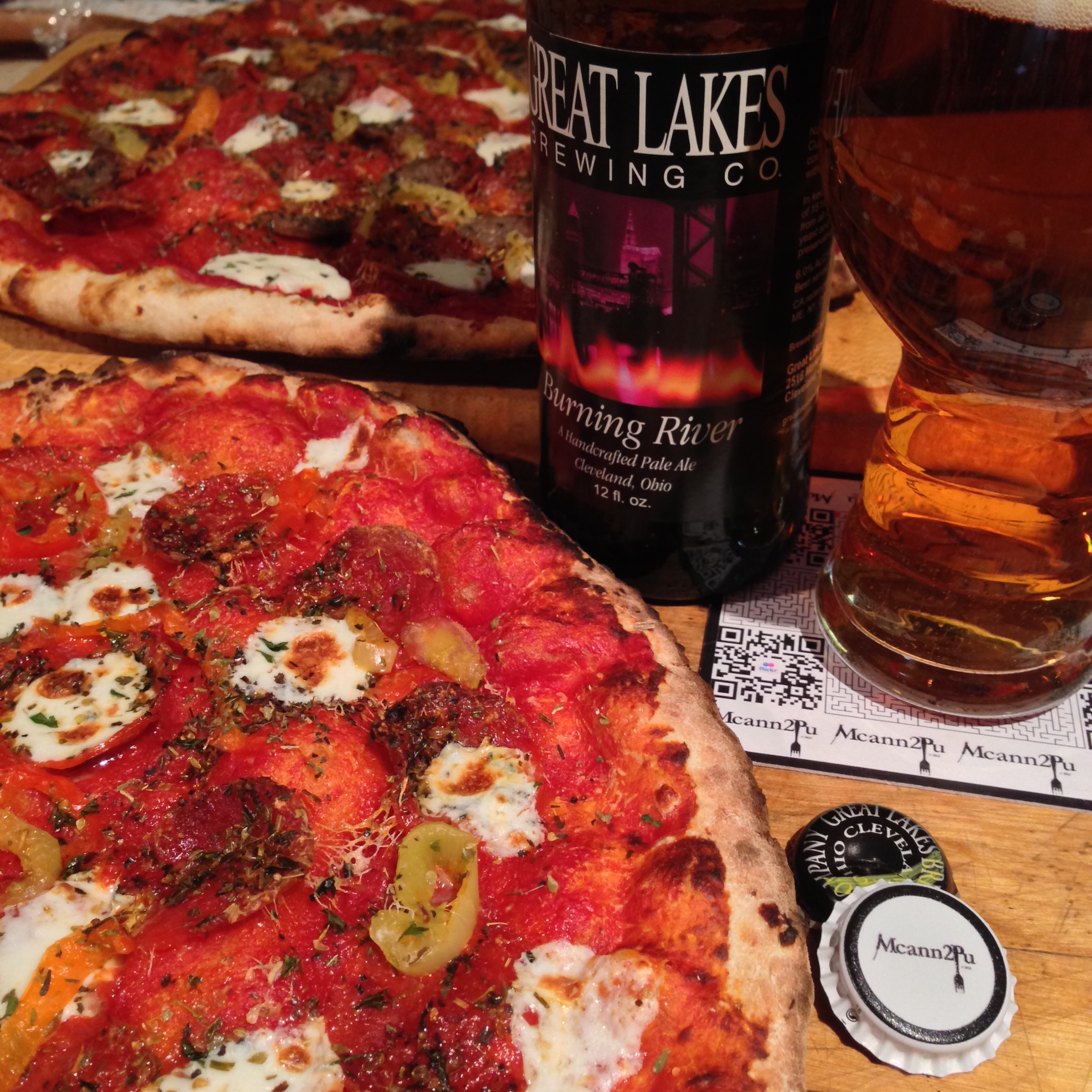 Pepperoni and Pickled Pepper Pizza paired with beer.