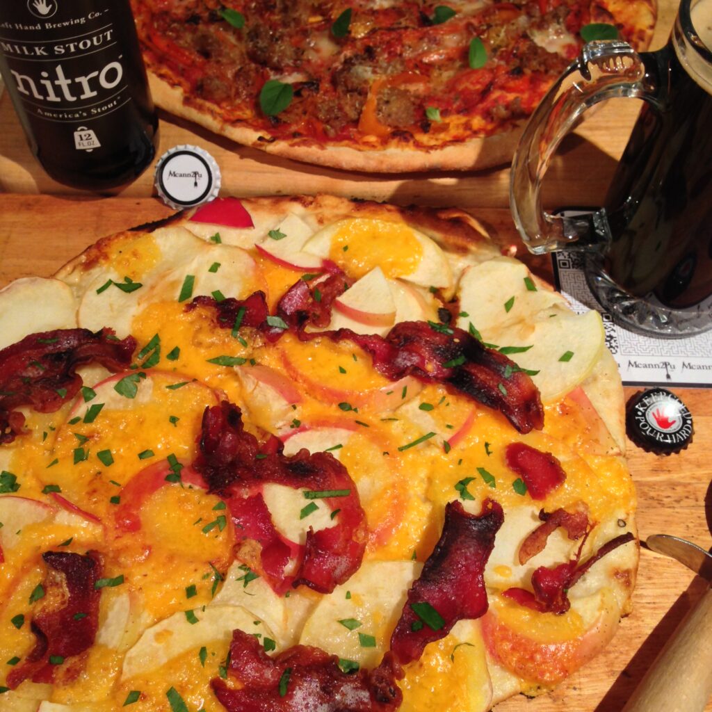 apple, bacon, and cheddar pizza served with a beer pairing.